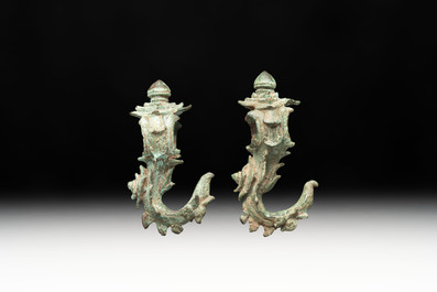A collection of a bronze sculpture, three palanquin hooks and an elephant-form kendi, Cambodia, 13th C. and earlier