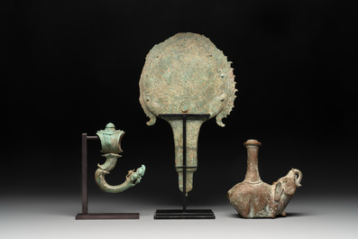 A collection of a bronze sculpture, three palanquin hooks and an elephant-form kendi, Cambodia, 13th C. and earlier