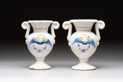 A pair of blue, white and yellow Dutch Delft altar vases, late 17th C.
