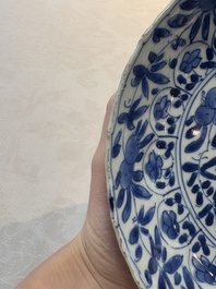 A Chinese blue and white octagonal vase and a plate with floral design, Kangxi