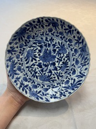 A Chinese blue and white octagonal vase and a plate with floral design, Kangxi