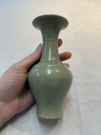 A pair of white-glazed oil lamps, a Longquan celadon vase and Yaozhou celadon box and cover, Ming/Qing