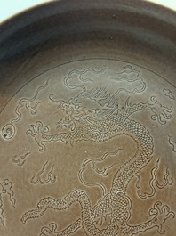 A Chinese aubergine-glazed 'dragon' plate, Jiaqing mark, 19/20th C.