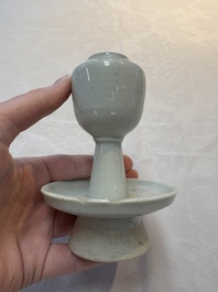 A pair of white-glazed oil lamps, a Longquan celadon vase and Yaozhou celadon box and cover, Ming/Qing
