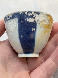 Thirteen Chinese blue and white 'Hatcher Cargo' cups and three celadon-glazed cups, Transitional period