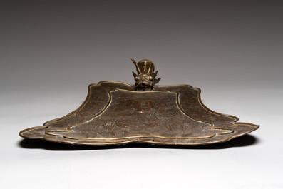 A Chinese brass fan-form temple sign with dragon and phoenix design, Xuantong and Yue Sheng Tang 悅勝堂 mark, dated 1911