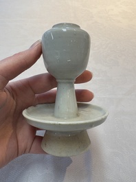 A pair of white-glazed oil lamps, a Longquan celadon vase and Yaozhou celadon box and cover, Ming/Qing
