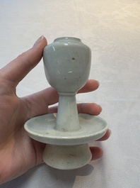A pair of white-glazed oil lamps, a Longquan celadon vase and Yaozhou celadon box and cover, Ming/Qing