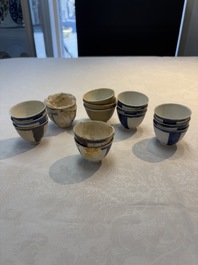 Thirteen Chinese blue and white 'Hatcher Cargo' cups and three celadon-glazed cups, Transitional period