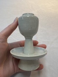 A pair of white-glazed oil lamps, a Longquan celadon vase and Yaozhou celadon box and cover, Ming/Qing