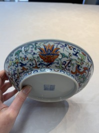 A Chinese doucai plate with floral design, Qianlong mark, 20th C.