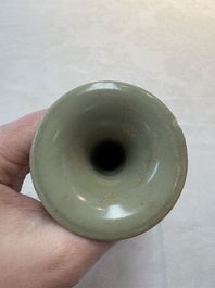 A pair of white-glazed oil lamps, a Longquan celadon vase and Yaozhou celadon box and cover, Ming/Qing