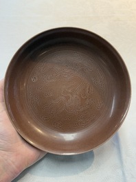 A Chinese aubergine-glazed 'dragon' plate, Jiaqing mark, 19/20th C.