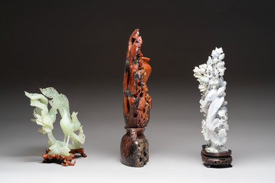 A Chinese soapstone vase with stand and two jadeite carvings on wooden stands, 19/20th C.