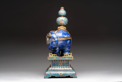 A Chinese lapis lazuli and cloisonn&eacute; elephant on stand, 19/20th C.