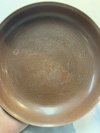 A Chinese aubergine-glazed 'dragon' plate, Jiaqing mark, 19/20th C.