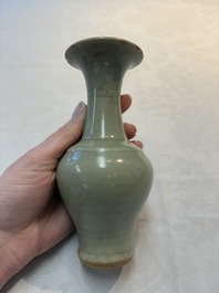 A pair of white-glazed oil lamps, a Longquan celadon vase and Yaozhou celadon box and cover, Ming/Qing