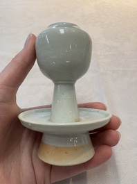 A pair of white-glazed oil lamps, a Longquan celadon vase and Yaozhou celadon box and cover, Ming/Qing