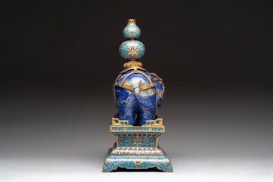 A Chinese lapis lazuli and cloisonn&eacute; elephant on stand, 19/20th C.