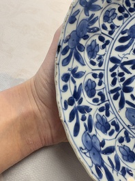 A Chinese blue and white octagonal vase and a plate with floral design, Kangxi