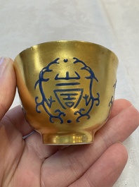 A pair of Chinese gilt-and blue-enamelled 'shou 壽' cups, Daoguang mark and possibly of the period