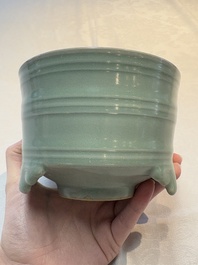 A Chinese Longquan celadon cylindrical tripod censer with &lsquo;trigrams&rsquo; design, Yuan/Ming