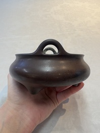 A Chinese bronze tripod censer, Xuande mark, 17/18th C.