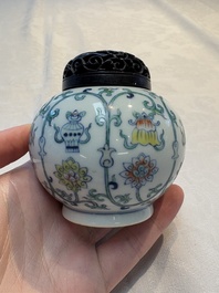 A Chinese doucai 'bajixiang' vase with a reticulated wooden cover, Yongzheng mark, 19/20th C.