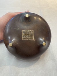 A Chinese bronze tripod censer, Xuande mark, 17/18th C.