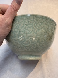 A Chinese Swatow celadon-glazed bowl with floral anhua design, 18th C.