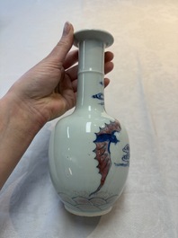 A pair of Chinese blue, white and copper-red 'bats among the clouds' vases, 19th C.