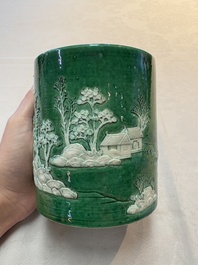 A Chinese verte biscuit 'riverscape' brush pot, artemisia leaf mark, 19th C.