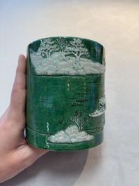 A Chinese verte biscuit 'riverscape' brush pot, artemisia leaf mark, 19th C.