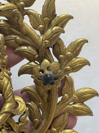 A Nepalese gilt-bronze Buddha on an inscribed throne with a mandorla, 19th C.