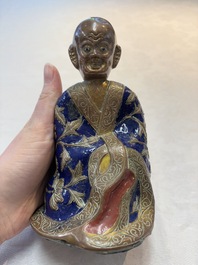 A Chinese champlev&eacute; figure of Luohan, Qianlong mark, 18/19th C.