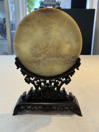 A pair of Chinese carved jade &lsquo;elephant&rsquo; plaques on wooden stands, 19th C.