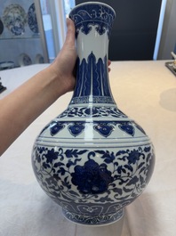 A Chinese blue and white 'flower scroll' bottle vase, Xuantong mark, 20th C.