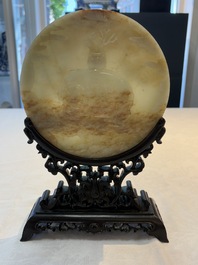 A pair of Chinese carved jade &lsquo;elephant&rsquo; plaques on wooden stands, 19th C.