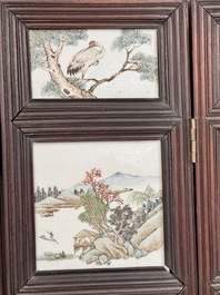 A rare Chinese eight-panel hongmu room divider with 48 qianjiang cai plaques, signed Jia Xingqing 贾醒卿, dated 1902