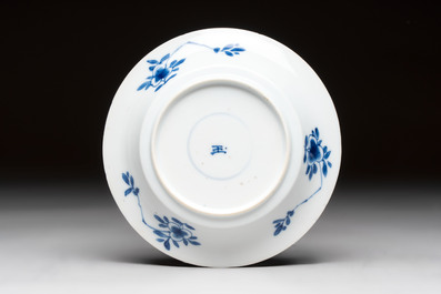 A Chinese blue and white 'Mongolian hunting' cup and saucer, jade mark, Kangxi