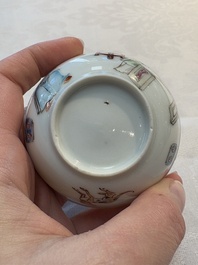 A Chinese iron-red-decorated 'boy and buffalo' cup and saucer and a famille rose 'Xi Xiang Ji' cup and saucer, Qianlong