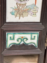 A rare Chinese eight-panel hongmu room divider with 48 qianjiang cai plaques, signed Jia Xingqing 贾醒卿, dated 1902