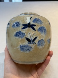 A Chinese famille verte covered vase, a pair of blue and white jars on wooden stands and two jars, 19th C.