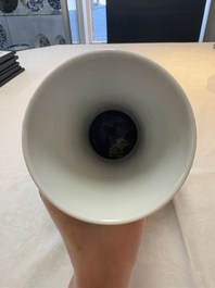 A Chinese blue and white 'flower scroll' bottle vase, Xuantong mark, 20th C.