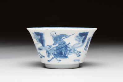 A Chinese blue and white 'Mongolian hunting' cup and saucer, jade mark, Kangxi