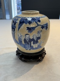A Chinese famille verte covered vase, a pair of blue and white jars on wooden stands and two jars, 19th C.