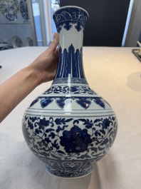 A Chinese blue and white 'flower scroll' bottle vase, Xuantong mark, 20th C.