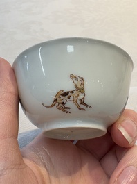 A Chinese iron-red-decorated 'boy and buffalo' cup and saucer and a famille rose 'Xi Xiang Ji' cup and saucer, Qianlong