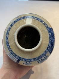 A Chinese famille verte covered vase, a pair of blue and white jars on wooden stands and two jars, 19th C.
