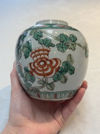 A Chinese famille verte covered vase, a pair of blue and white jars on wooden stands and two jars, 19th C.